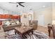 Open concept living room featuring neutral paint and tile floors that flow into the adjacent kitchen at 15608 Starling Water Dr, Lithia, FL 33547