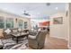 Spacious living room area featuring an open floor plan, neutral walls and tile flooring with backyard view at 15608 Starling Water Dr, Lithia, FL 33547
