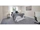 Comfortable bedroom showcasing modern decor, a plush bed, and abundant natural light from the window at 1575 Wicklow Dr, Palm Harbor, FL 34684