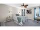 Main bedroom with a ceiling fan, carpet floors, and decor at 1575 Wicklow Dr, Palm Harbor, FL 34684