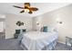 This bedroom features a striking ceiling fan and soothing wall colors, creating a relaxing retreat at 1575 Wicklow Dr, Palm Harbor, FL 34684