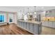 Kitchen with an island, stainless appliances and light gray cabinets at 1575 Wicklow Dr, Palm Harbor, FL 34684