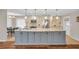 Spacious kitchen island with stone countertops and lots of cabinets at 1575 Wicklow Dr, Palm Harbor, FL 34684