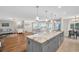 Open floorplan kitchen featuring a large island with a sink at 1575 Wicklow Dr, Palm Harbor, FL 34684
