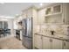 View of the kitchen featuring stainless appliances and light colored cabinets at 1575 Wicklow Dr, Palm Harbor, FL 34684