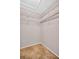 Empty walk-in closet with wire shelving providing customizable storage options for an organized wardrobe at 1575 Wicklow Dr, Palm Harbor, FL 34684