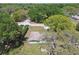Aerial view of the charming home on a wooded lot in a quiet neighborhood at 16044 Stur St, Brooksville, FL 34604