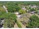 Aerial view of home nestled among mature trees and lush landscaping at 16044 Stur St, Brooksville, FL 34604