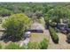 Aerial view of the property, showing the home and surrounding mature trees at 16044 Stur St, Brooksville, FL 34604