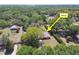 Aerial view of the home nestled among mature trees and lush landscaping at 16044 Stur St, Brooksville, FL 34604