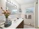 Bright bathroom featuring a single sink vanity and good lighting at 16044 Stur St, Brooksville, FL 34604