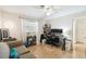 Well-lit bedroom offering a desk area, sofa, and comfortable features at 16044 Stur St, Brooksville, FL 34604