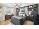 Comfortable bedroom with a queen-size bed, modern decor, and ample natural light at 16044 Stur St, Brooksville, FL 34604