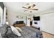 Cozy bedroom showcasing a patterned bedspread, and convenient closet storage at 16044 Stur St, Brooksville, FL 34604