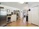 Bright, open kitchen showcasing modern appliances, ample storage, and a seamless flow into the rest of the home at 16044 Stur St, Brooksville, FL 34604