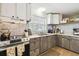 Charming kitchen with a stainless steel stove and decorative backsplash tiles at 16044 Stur St, Brooksville, FL 34604