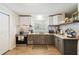 Efficient kitchen featuring modern appliances, storage and neutral countertops at 16044 Stur St, Brooksville, FL 34604