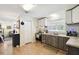An open kitchen with modern cabinets, stainless steel appliances, and an inviting view into the next room at 16044 Stur St, Brooksville, FL 34604