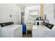 A spacious laundry room with modern washer and dryer units, and with space for other appliances at 16044 Stur St, Brooksville, FL 34604