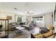 Inviting living room featuring a plush sectional sofa, and stylish decor at 16044 Stur St, Brooksville, FL 34604
