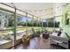 Enclosed patio, furnished, offering a tranquil space for relaxation and enjoyment of the outdoors at 16044 Stur St, Brooksville, FL 34604