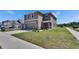 This two-story home offers a well-manicured lawn and a two-car garage, blending style with functionality at 16894 Delia St, Wimauma, FL 33598