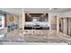 Open concept kitchen featuring stainless steel appliances, dark cabinetry, and granite countertops at 16894 Delia St, Wimauma, FL 33598