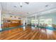 Spacious clubhouse interior with a kitchenette, tables, and chairs, ideal for community gatherings and events at 1806 Mariner Dr # 112, Tarpon Springs, FL 34689