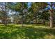 Beautifully maintained community common area with large trees and landscaping at 1806 Mariner Dr # 112, Tarpon Springs, FL 34689