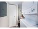 Well-organized laundry area with washer, dryer and storage space at 1806 Mariner Dr # 112, Tarpon Springs, FL 34689
