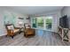 Living room features a large balcony and comfortable seating at 1806 Mariner Dr # 112, Tarpon Springs, FL 34689