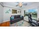 Bright and airy living room area, perfect for relaxation or entertainment with a view of the neighborhood at 1806 Mariner Dr # 112, Tarpon Springs, FL 34689