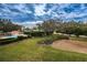 Relaxing pool area view amidst lush greenery, offering a serene and private retreat at 1806 Mariner Dr # 112, Tarpon Springs, FL 34689