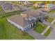 Aerial view of a well-maintained home with a landscaped yard in a suburban neighborhood at 19475 Bristol Wood Pl, Brooksville, FL 34601