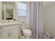 Bright bathroom features a modern vanity, white subway tile, and shower-tub combo at 19475 Bristol Wood Pl, Brooksville, FL 34601