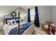 Bedroom featuring a canopy bed, dark curtains, and a bright, inviting atmosphere at 19475 Bristol Wood Pl, Brooksville, FL 34601