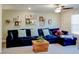 Bonus room with a comfortable sofa, floating picture shelves and a wooden coffee table at 19475 Bristol Wood Pl, Brooksville, FL 34601