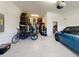 Spacious two car garage with lots of storage, bikes, and a Mini Cooper at 19475 Bristol Wood Pl, Brooksville, FL 34601