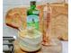 Close-up of modern kitchen décor including olive oil, grinder, and wooden board at 19475 Bristol Wood Pl, Brooksville, FL 34601