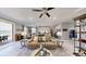 Open-concept living space connecting the living room, dining area, and kitchen with modern decor at 19475 Bristol Wood Pl, Brooksville, FL 34601