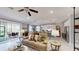 Bright and airy living space showcasing open layout connecting living room, dining area, and kitchen at 19475 Bristol Wood Pl, Brooksville, FL 34601