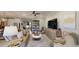 Well-designed living room featuring stylish decor and ample seating, leading into the open kitchen area at 19475 Bristol Wood Pl, Brooksville, FL 34601
