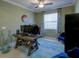 Office area featuring a computer desk, blue chairs and natural light from the window at 19475 Bristol Wood Pl, Brooksville, FL 34601