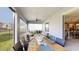 Relaxing screened porch has dining and living areas with backyard views at 19475 Bristol Wood Pl, Brooksville, FL 34601