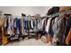 Spacious walk-in closet with organized clothing, shoe racks, and ample storage at 19475 Bristol Wood Pl, Brooksville, FL 34601