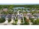 Aerial view showcasing property location, surrounded by lush greenery and a tranquil lake at 20113 Bending Creek Pl, Tampa, FL 33647