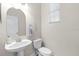 Stylish half bathroom with a pedestal sink and modern fixtures at 20113 Bending Creek Pl, Tampa, FL 33647