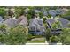 Charming two-story home with a well-manicured lawn, lush landscaping, and inviting front porch at 20113 Bending Creek Pl, Tampa, FL 33647