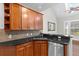 Kitchen featuring stainless steel appliances, dark countertops, and bright overhead lighting at 20113 Bending Creek Pl, Tampa, FL 33647