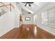 Open floor plan featuring hardwood floors, high ceilings, staircase, and natural light at 20113 Bending Creek Pl, Tampa, FL 33647